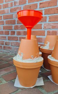Olla mit Trichter befüllen